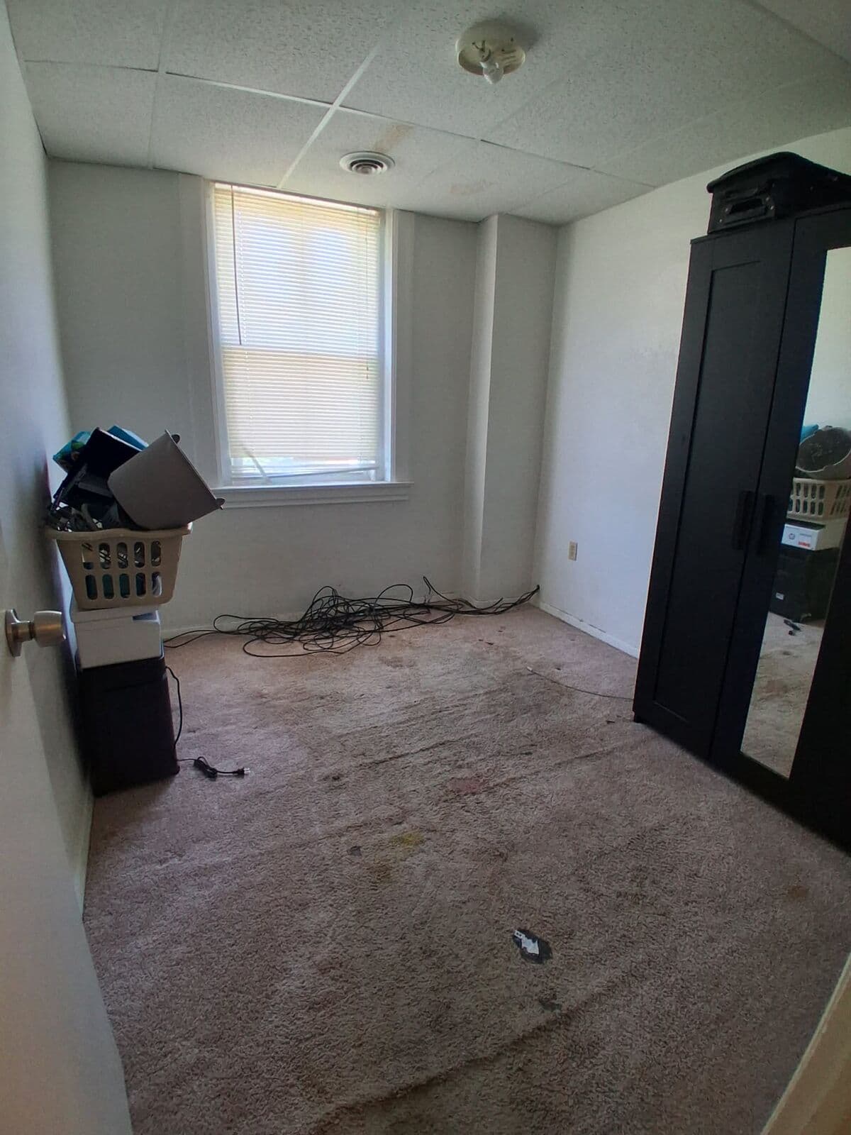 After: Bedroom cleared with open carpet