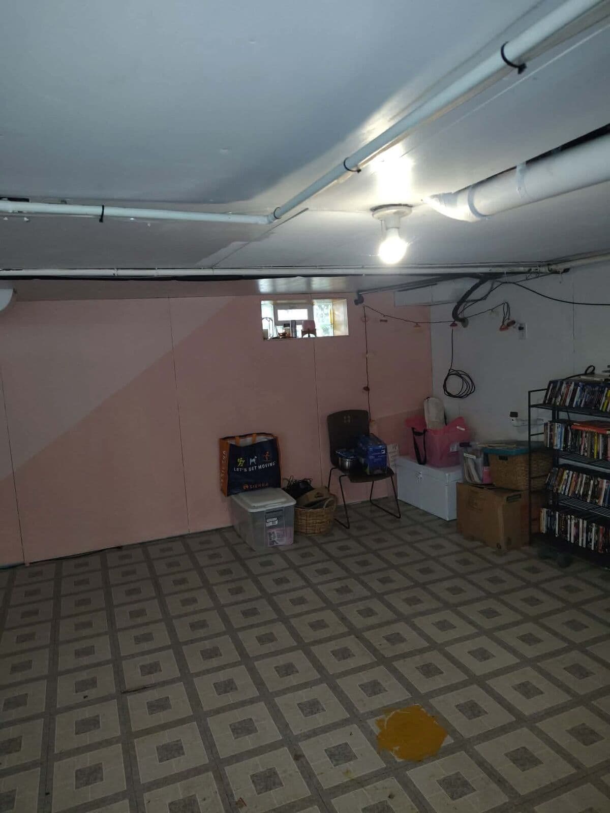 After: Basement cleared with items sorted against the wall