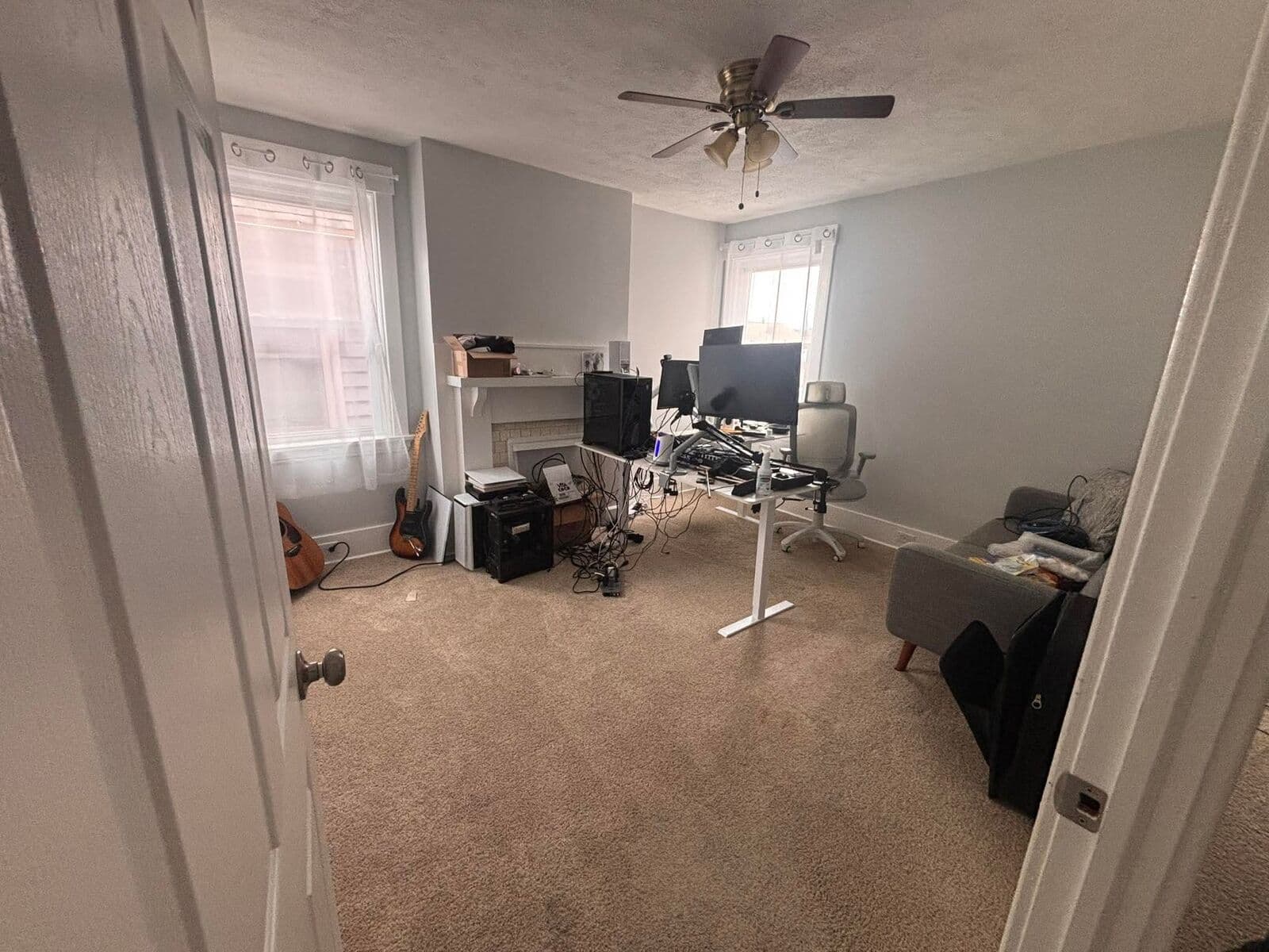 After: Same home office cleared with desk and carpet visible