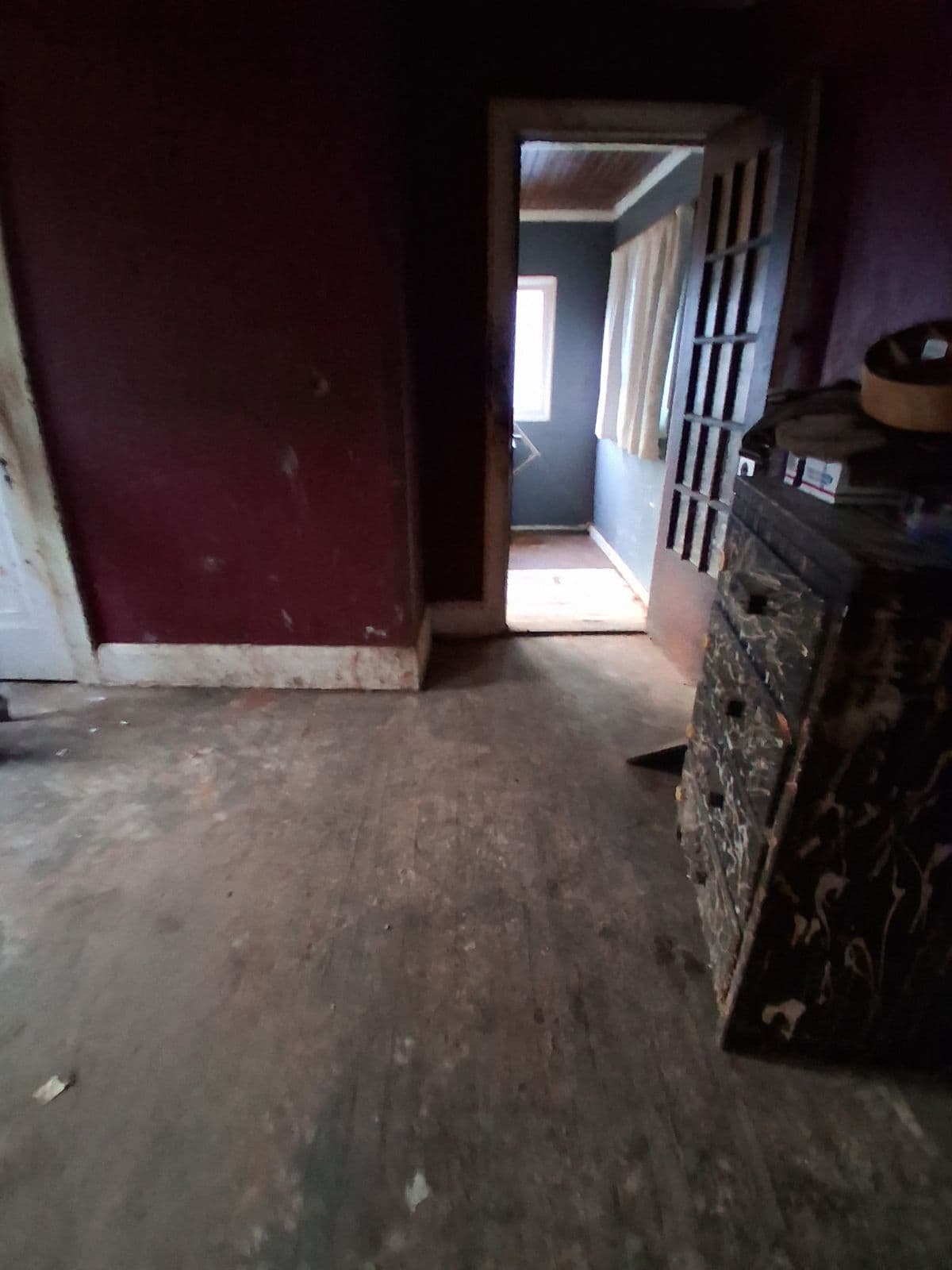 After: Same room and doorway cleared down to the wood floor