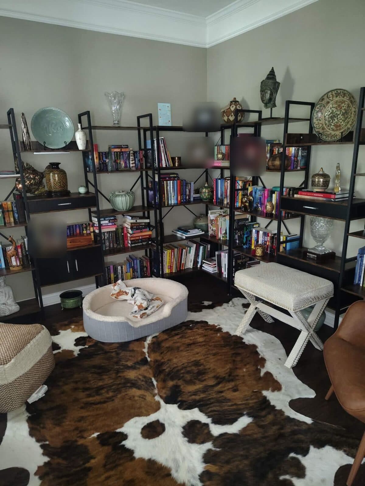 After: Same sitting room organized with bookshelves and open floor