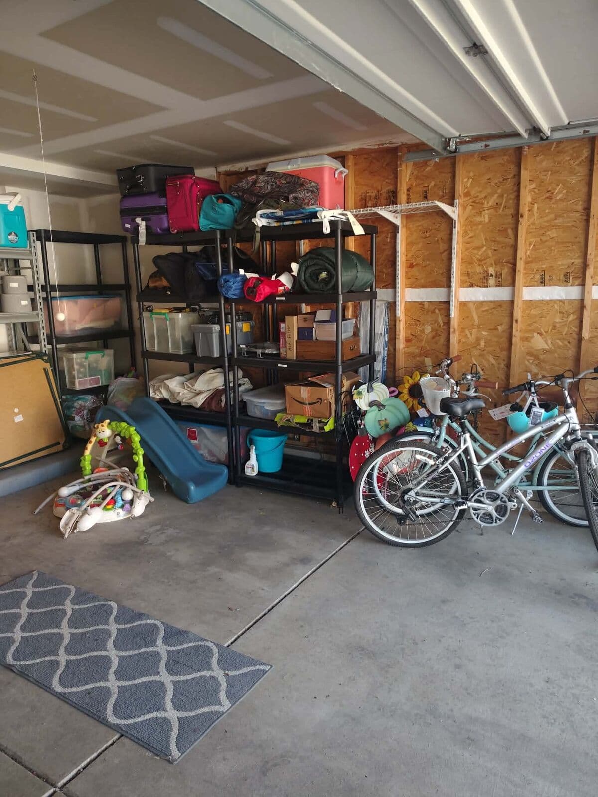 After: Garage organized onto shelving with bikes stored neatly