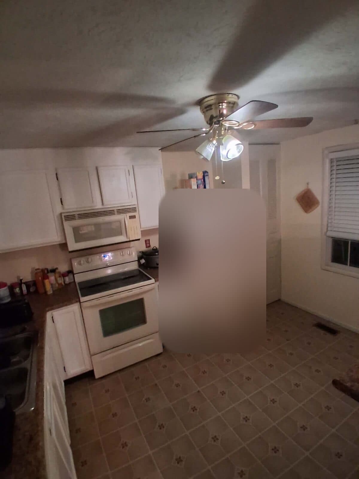 After: Same kitchen cleared with open floor and clean counters