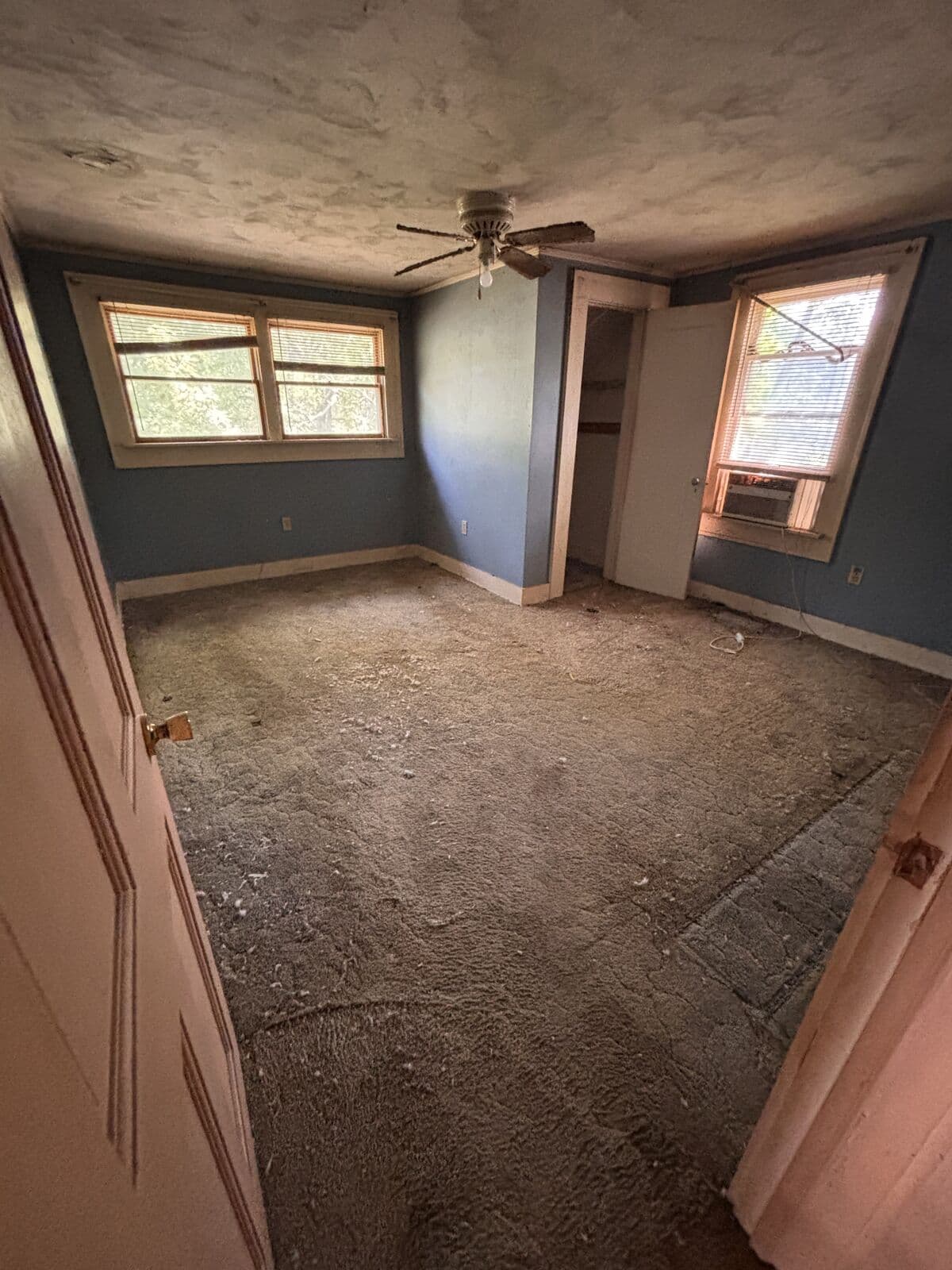 After: Bedroom emptied to bare walls and floor